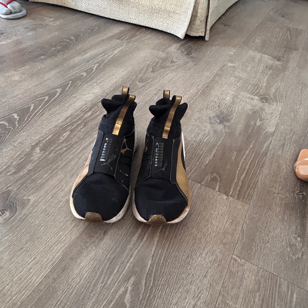 Puma Black and Gold Sneakers